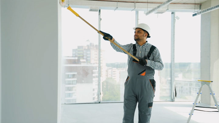 indian painter painting a wall in office 2024 07 22 20 40 28 utc